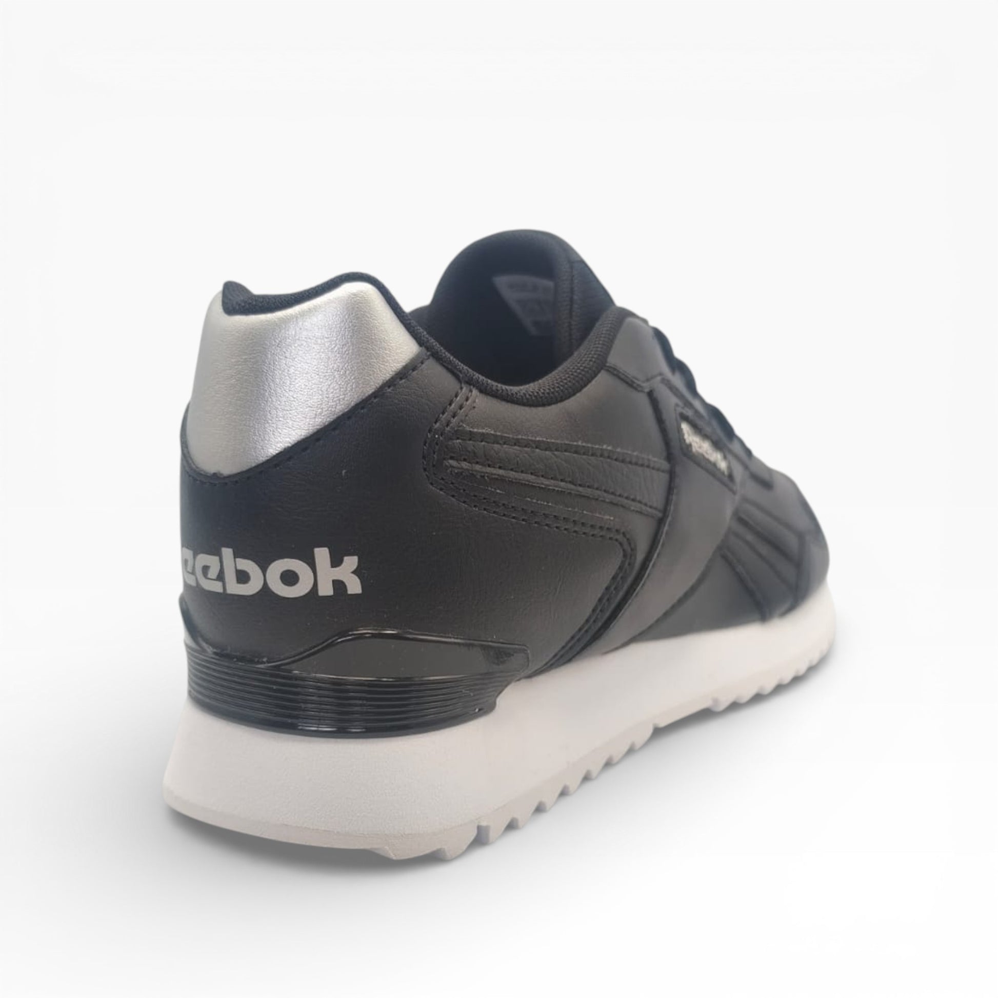 Sneaker basse noire Reebok Glide Ripple avec détail argent, semelle blanche, LA CHAUSSURERIE