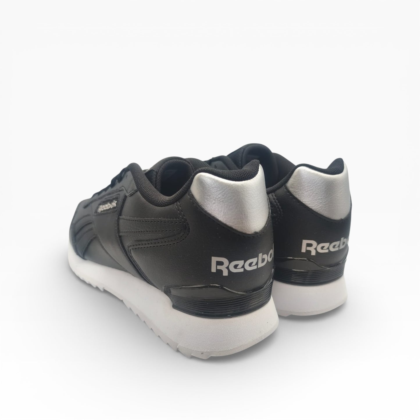 Baskets basses Reebok Glide noires et argent sur fond blanc, LA CHAUSSURERIE