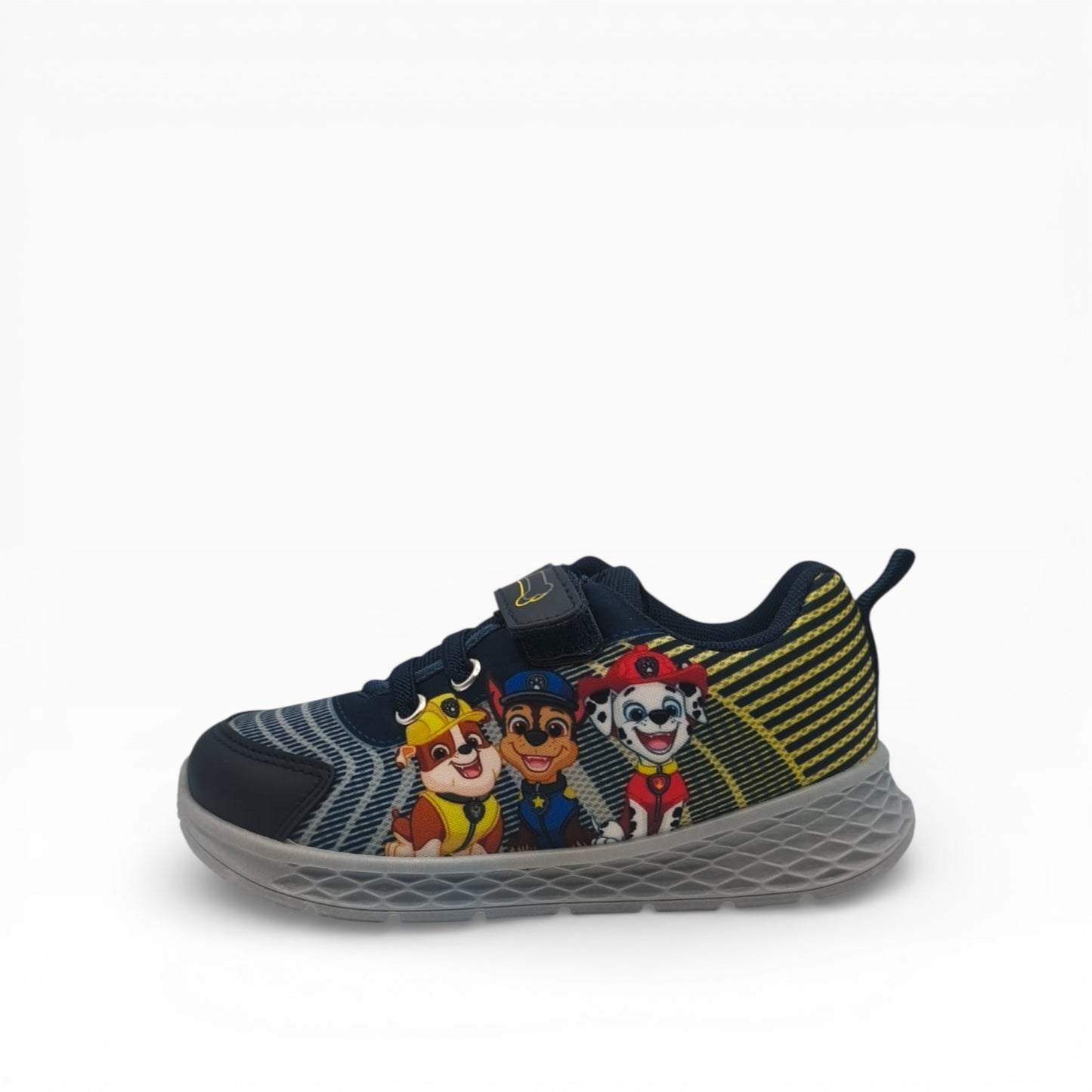 Détail du côté droit de la basket Pat' Patrouille avec motifs jaunes et gris.